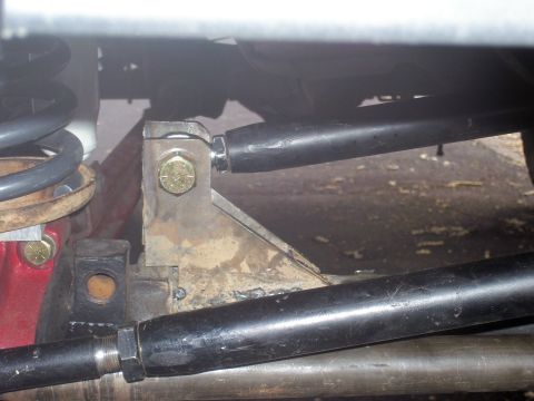 1991 Ford Bronco - Custom suspension bracket and tie rod ends are visible in this close-up shot.
