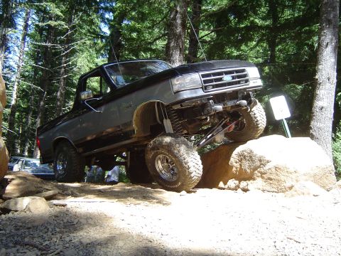 1989 Ford Bronco - Modified 1989 Ford Bronco navigates a rocky off-road course.