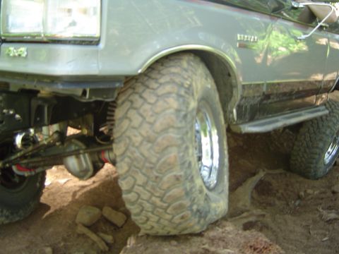 1989 Ford Bronco - This vehicle is equipped with large, knobby tires and appears to be navigating a challenging off-road course.