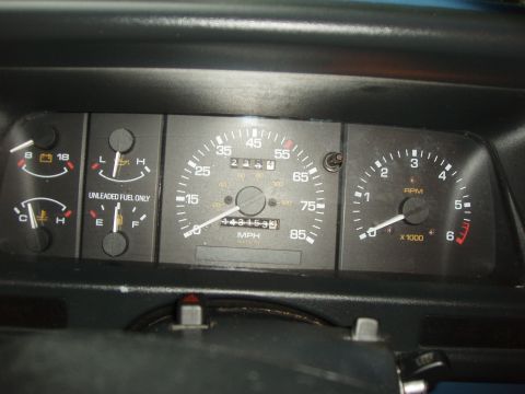 1994 Mazda B3000 - Interior view of a vehicle's dashboard gauges, including a speedometer and tachometer.