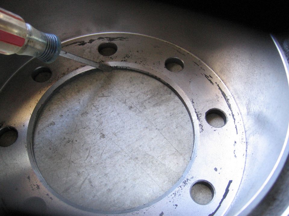 back of ford van rotor.  note the large hat area and the reverse chamfer designed to sit on the outside of the hub as opposed to the Chevy rotor that is supposed to be pressed on from the back of the hub