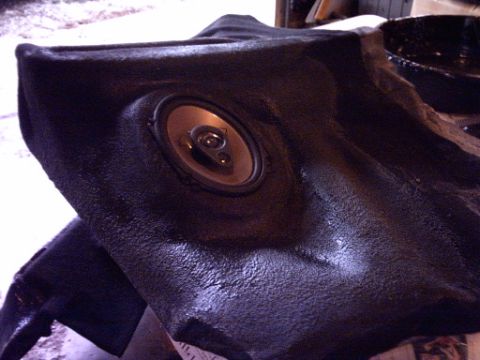 1995 Ford Probe - A speaker is visible within a textured black trim panel, possibly from a car's interior.