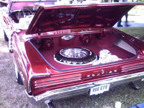1995 Ford Probe - This 1966 Pontiac GTO convertible features a custom trunk interior with a spare tire and audio equipment.