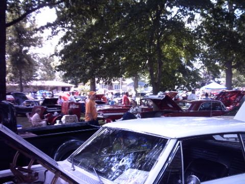 1995 Ford Probe - A gathering of classic cars and attendees at an outdoor event, with several vehicles on display.