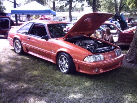 1995 Ford Probe - This 1995 Ford Mustang GT 5.0 is displayed with its hood open at an outdoor event.