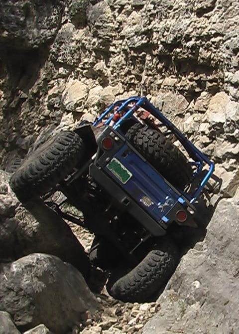 1981 Ford Bronco - This off-road vehicle is navigating a difficult rocky terrain.