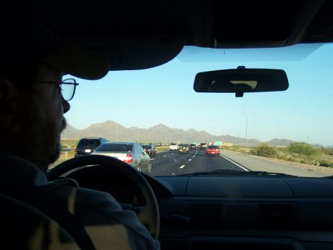 1995 Ford Probe - Driving on a highway with traffic and mountains in the distance.