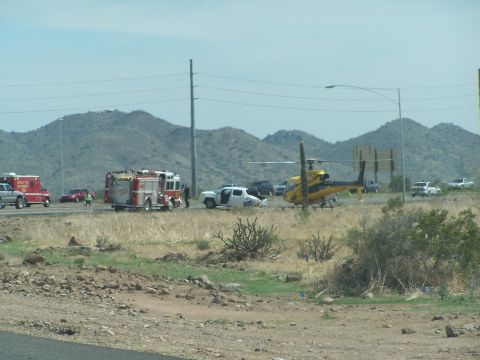 1995 Ford Probe - Emergency response scene with multiple vehicles and a helicopter on a highway.