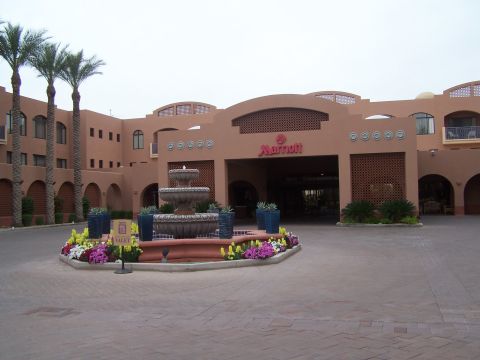 1995 Ford Probe - The entrance to a Marriott hotel features a fountain and landscaping.