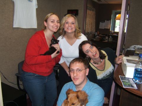 1995 Ford Probe - A group of people, some holding pets, pose for a photo in what appears to be an office environment.