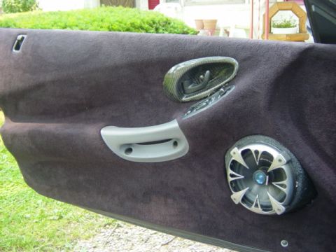 1995 Ford Probe - Interior view of a car door panel with aftermarket speaker and custom trim.
