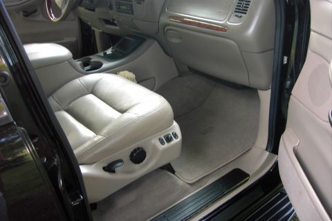 1996 Mercury Grand Marquis - The interior of a car, showing the passenger seat, dashboard, and floor mats.