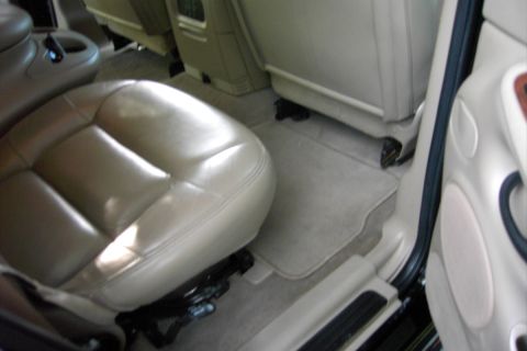 1996 Mercury Grand Marquis - The interior of a car shows tan leather seats and beige carpeting.