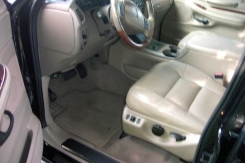 1996 Mercury Grand Marquis - Interior view of a 1996 Mercury Grand Marquis, highlighting the tan leather seats and dashboard.