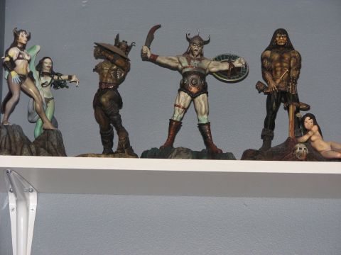 1991 Ford Bronco - A collection of fantasy-themed action figures displayed on a shelf.