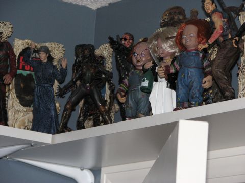 1991 Ford Bronco - Various horror movie action figures are displayed on a shelf.