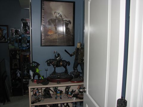 1991 Ford Bronco - Interior scene with various collectible figures and artwork displayed on shelves and walls.