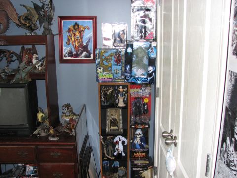 1991 Ford Bronco - Action figures and collectibles are displayed on shelves and a dresser in a room.