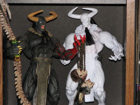 1991 Ford Bronco - Display of two fantasy action figures with horns and elaborate accessories.