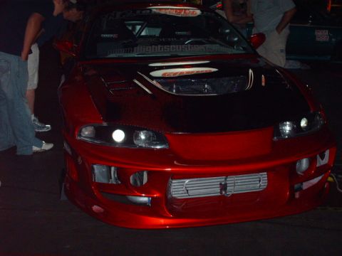 1995 Ford Probe - This modified sports car features an aggressive front bumper with an exposed intercooler and custom hood.