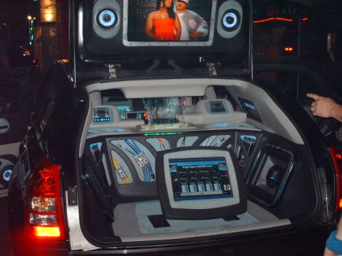 1995 Ford Probe - This modified car trunk features a custom entertainment system with multiple screens and a unique waterfall display.