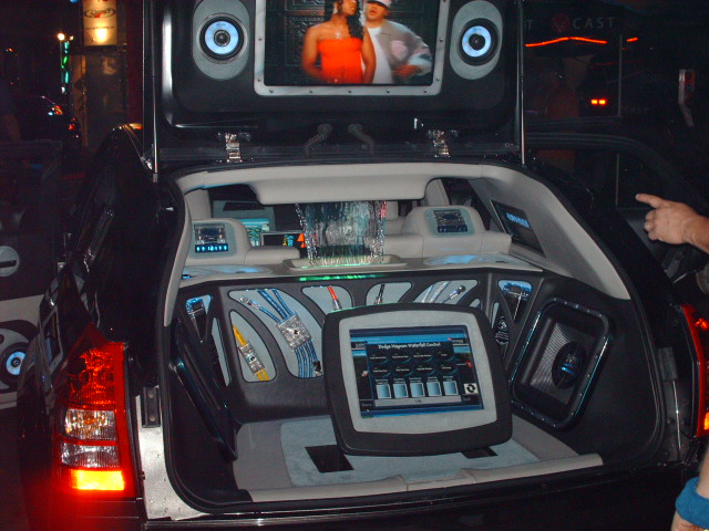 Black car trunk modified with screens, speakers, and a waterfall feature