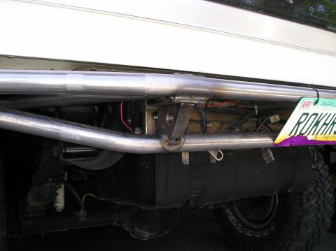 1993 Ford Bronco - A custom bumper and fuel tank are visible on the rear of a vehicle, with an Arizona license plate attached.