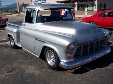 1972 Ford Ranchero - This 1955 Chevrolet pickup truck is parked next to a red 1969 Camaro.