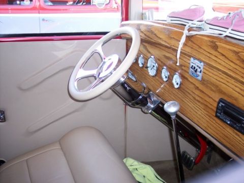 1972 Ford Ranchero - Interior view of a custom hot rod, a wood grain dashboard and a unique steering wheel.