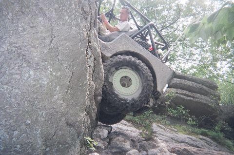 1976 GMC C/K Pickup - Driver navigates a challenging off-road course with a custom-built vehicle.
