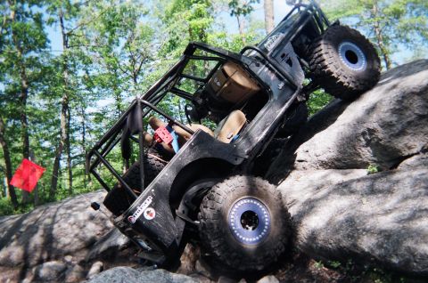 1976 GMC C/K Pickup - Modified Jeep Wrangler navigates a challenging rock crawling course.