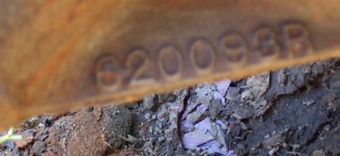 1978 Ford Bronco - Close-up of a metal part showing stamped identification numbers.