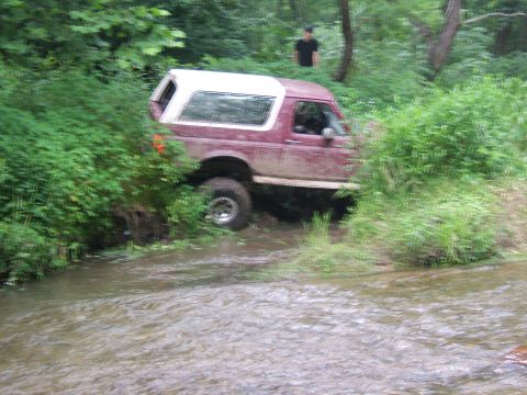 1993 Ford Bronco - 1993 Ford Bronco navigating a stream during an off-road excursion.