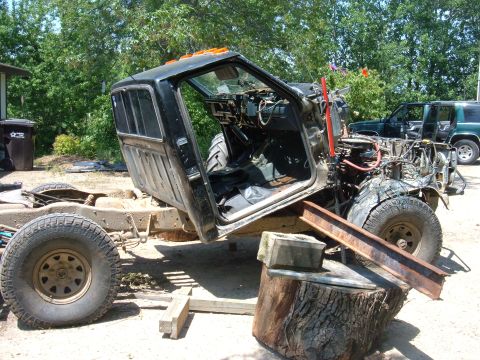 1985 Ford F-150 - The truck's cab is open, showing the interior, while the chassis sits without an engine.