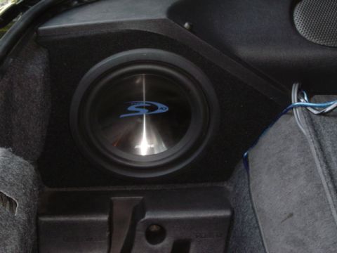 2002 Chevrolet Camaro - Custom subwoofer enclosure with an Alpine speaker, likely installed in a vehicle's trunk.