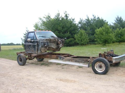 1985 Ford F-150 - This truck chassis has had its body removed, leaving only the cab and frame visible.