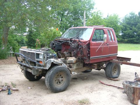1985 Ford F-150 - This truck's front end is disassembled, revealing its chassis and engine bay.