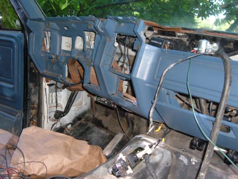1985 Ford F-150 - Interior view of a 1985 Ford F-150 with the dashboard disassembled for work.