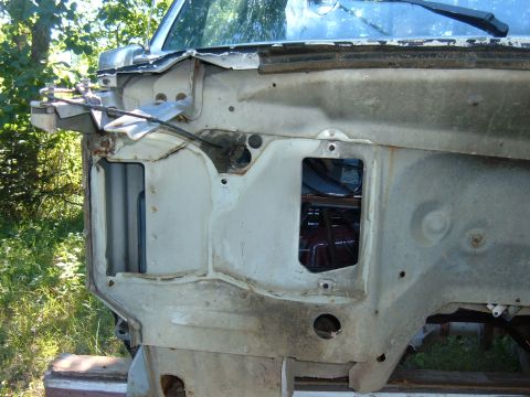 1985 Ford F-150 - The front section of a truck chassis is visible, with the firewall and inner fender well exposed.
