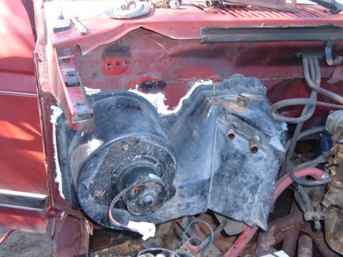 1985 Ford F-150 - Engine bay components including blower motor and heater core housing are visible.