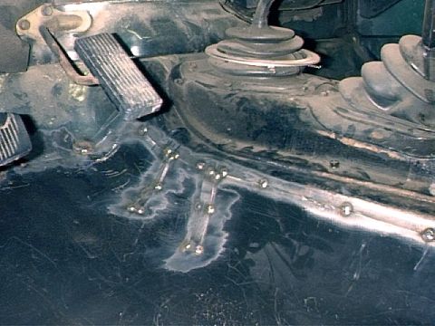 1979 Ford Bronco - Driver's Side - Floor pan tack welded in place. Had to make relief cuts to fit into place because of warping.