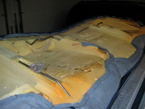1985 Ford LTD Crown Victoria - Close-up of car seat foam and springs, showing interior construction details.