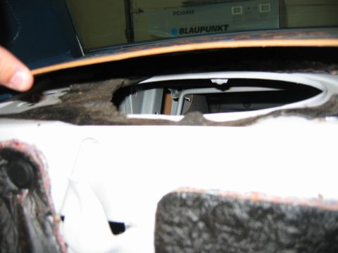 1985 Ford LTD Crown Victoria - Damage to the interior of a vehicle, revealing exposed metal and torn fabric.