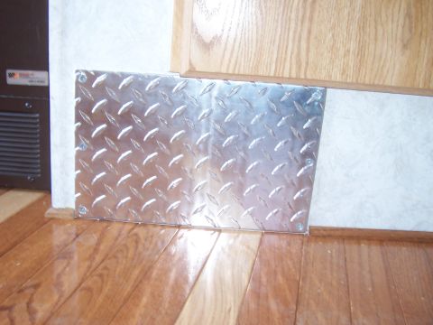 1994 Ford F-150 - Interior view of a vehicle showing a diamond plate panel on the floor.