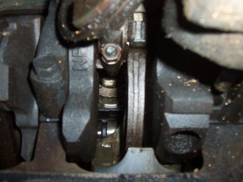1994 Ford F-150 - Close-up view of an engine's crankshaft and connecting rod, showing some internal mechanical components.
