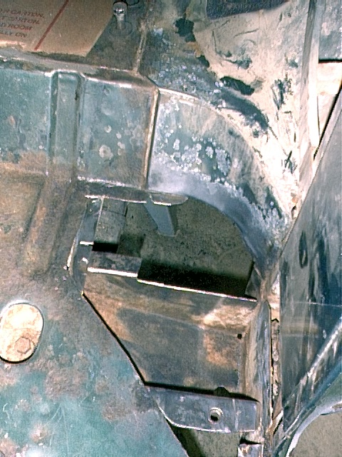 1979 Ford Bronco - Driver's side corner, more areas cut out and more rust cut out on frame roll cage support.