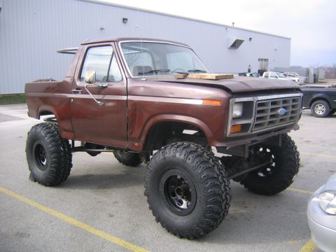 1982 Ford Bronco - This lifted Ford Bronco has a custom grille and large off-road tires.