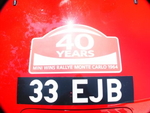 2001 Mercury Grand Marquis - Decal commemorates Mini's 1964 Monte Carlo Rally win on a red vehicle.