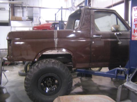 1982 Ford Bronco - This 1982 Ford Bronco is shown in a garage, possibly undergoing repairs or modifications.