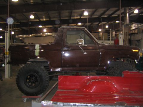 1982 Ford Bronco - This Ford Bronco appears to be undergoing modifications in a garage setting.